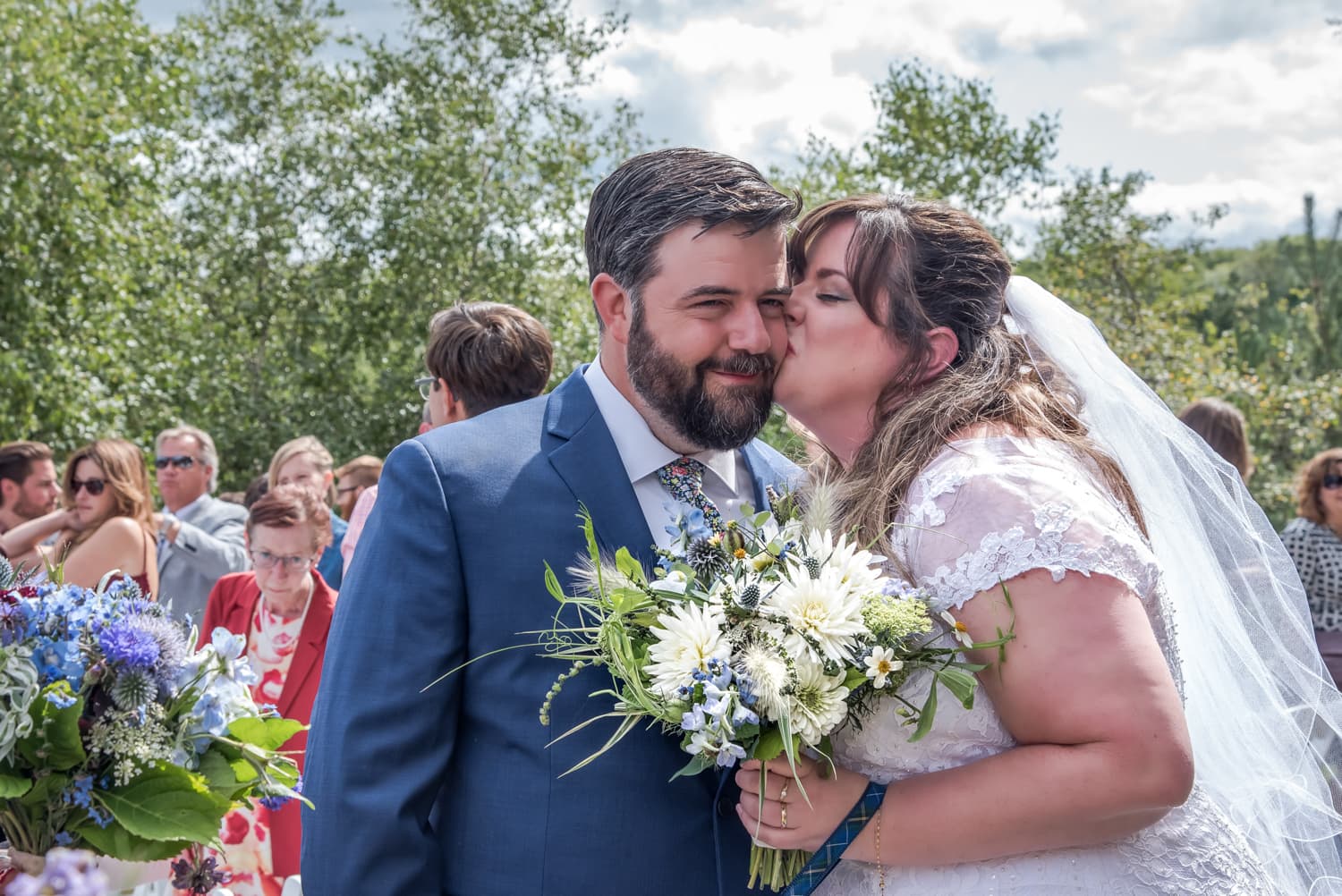 The bride and groom share a kiss after their wedding ceremony at the Best Western in Chocolate Lake Halifax, NS.