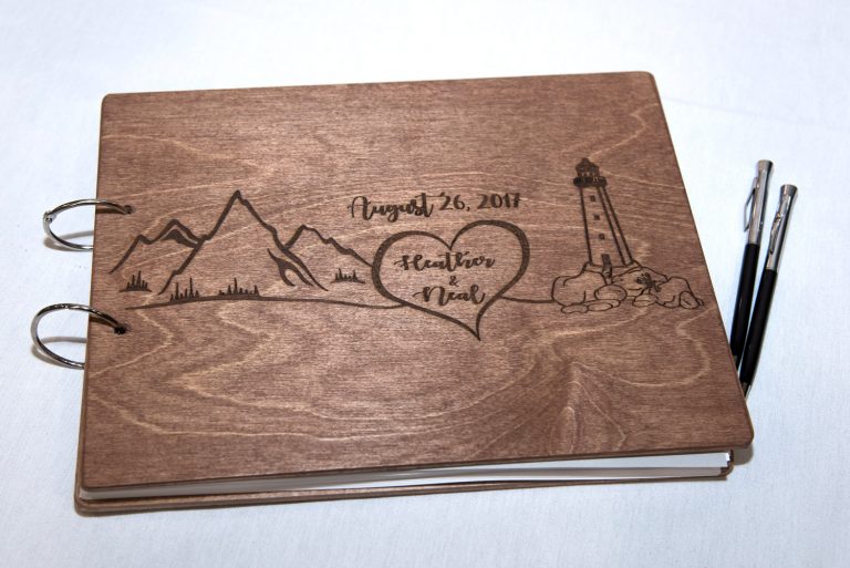 A wooden wedding guest book for guests to sign displayed at a wedding at Best Western Chocolate Lake in Halifax.