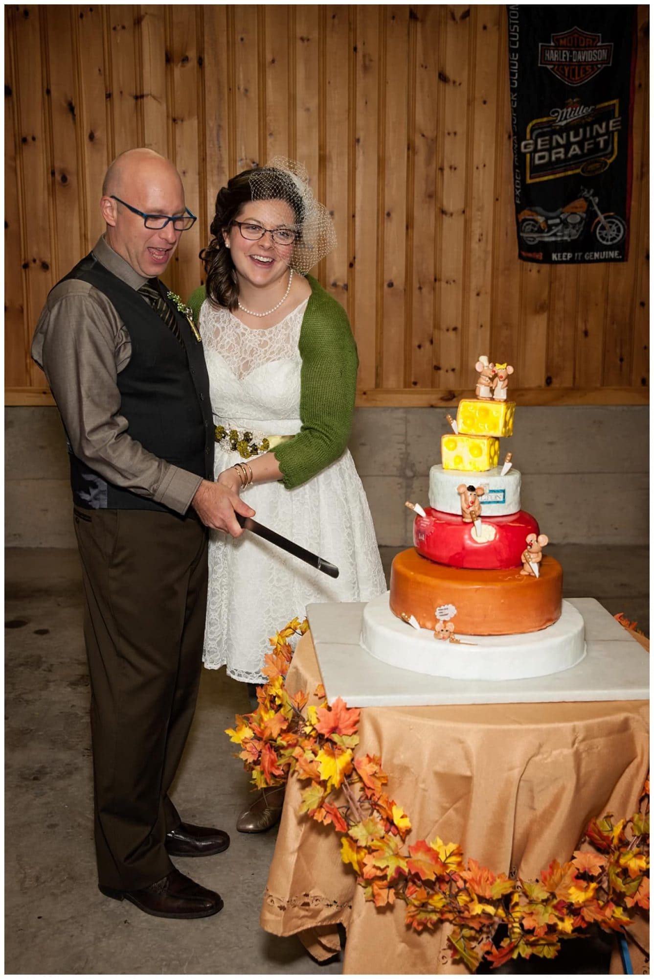 The bride and groom cut their very unique wedding cheesecake cake.