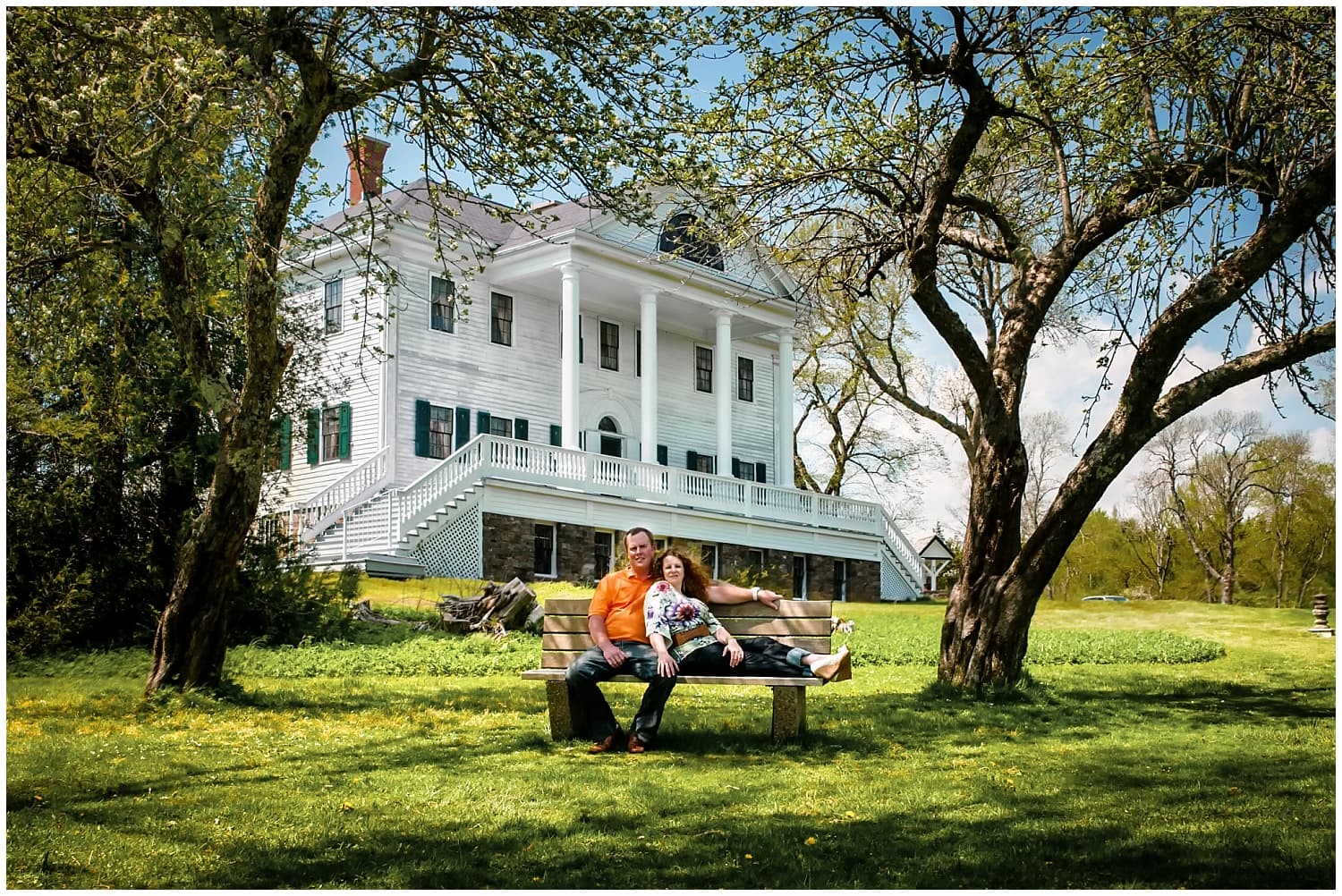 A lovely couple posing for their engagement photos at the Mount Uniacke House in Nova Scotia.