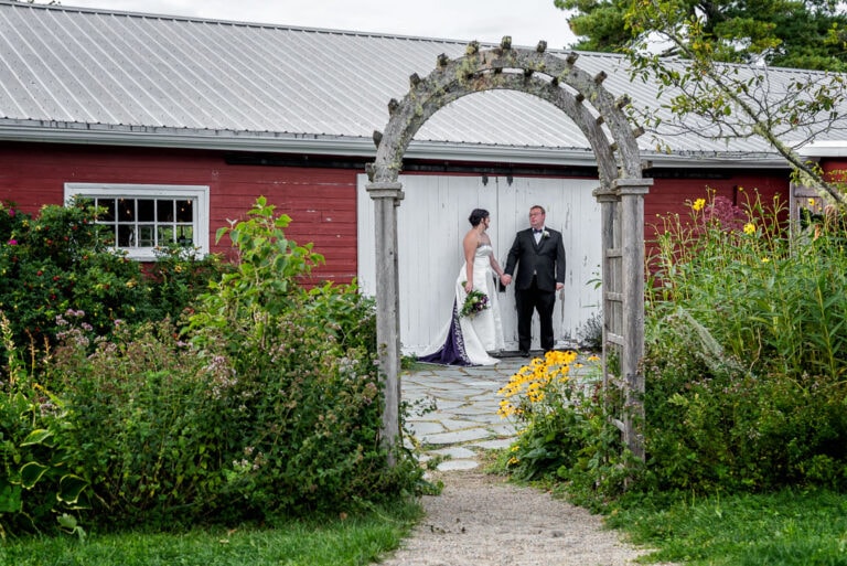 The bride and groom pose for wedding photos at the Hubbard's Barn in Nova Scotia.