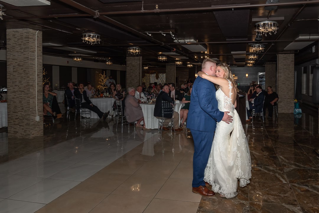 The bride and groom share their first dance during their wedding reception at the Bedford Basin Farmers Market in NS.