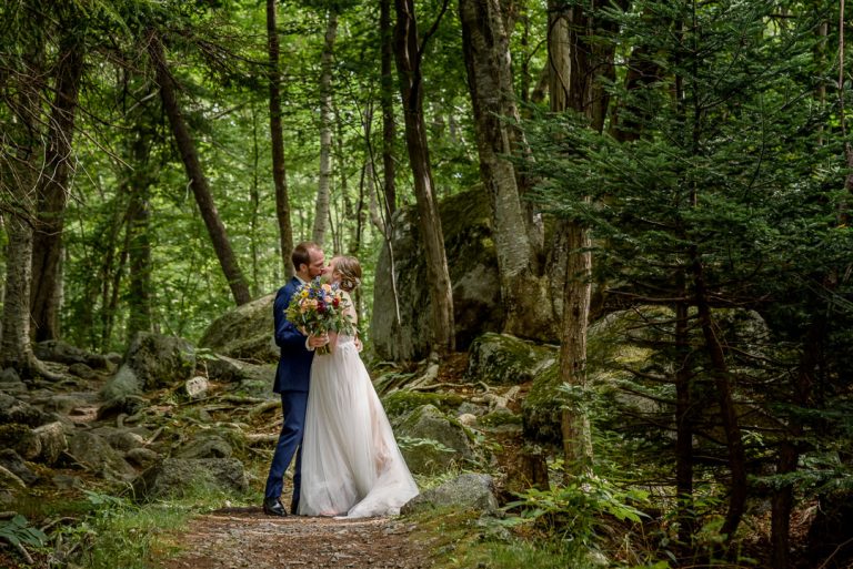 The bride and groom pose for stunning forest wedding photos at the Sir Sandford Fleming Park, captured by Halifax Wedding Photographers