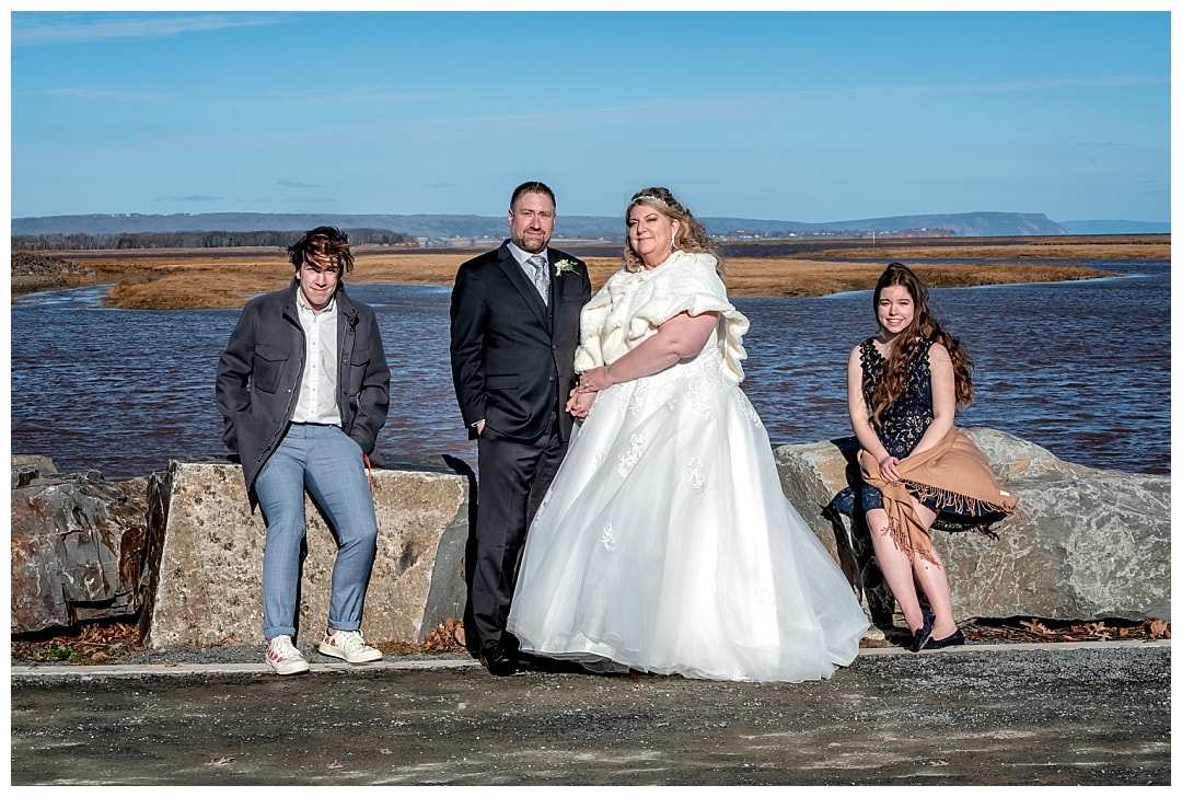 The bride and groom with their children on their wedding day in Wolfville NS.