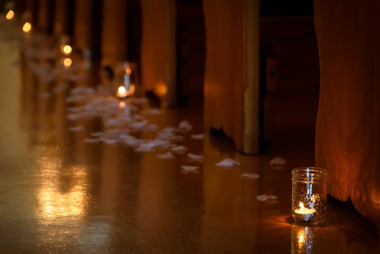 Remembering loved ones using candles and rose petals to light the aisle the bride walks up.