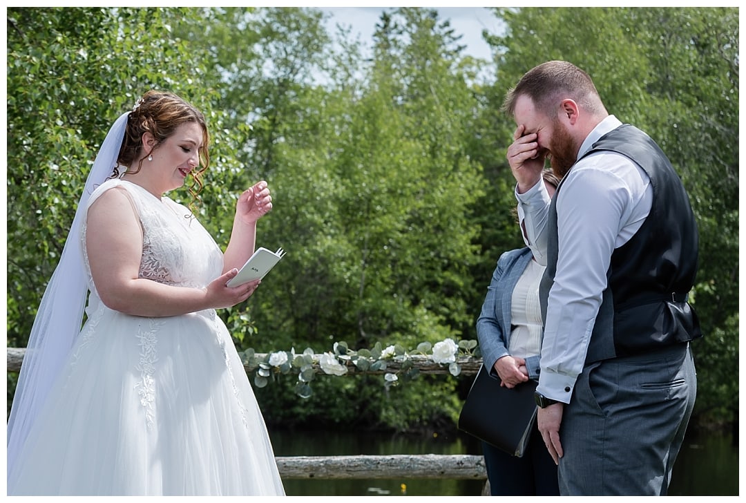 The bride and groom say their vows and make each other laugh during their wedding ceremony at Healy Farm in NS.