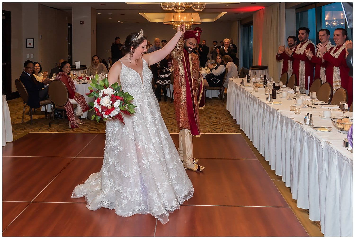 The bride and groom make their entrance to the wedding reception at Halifax Marriott Harbourfront Hotel.