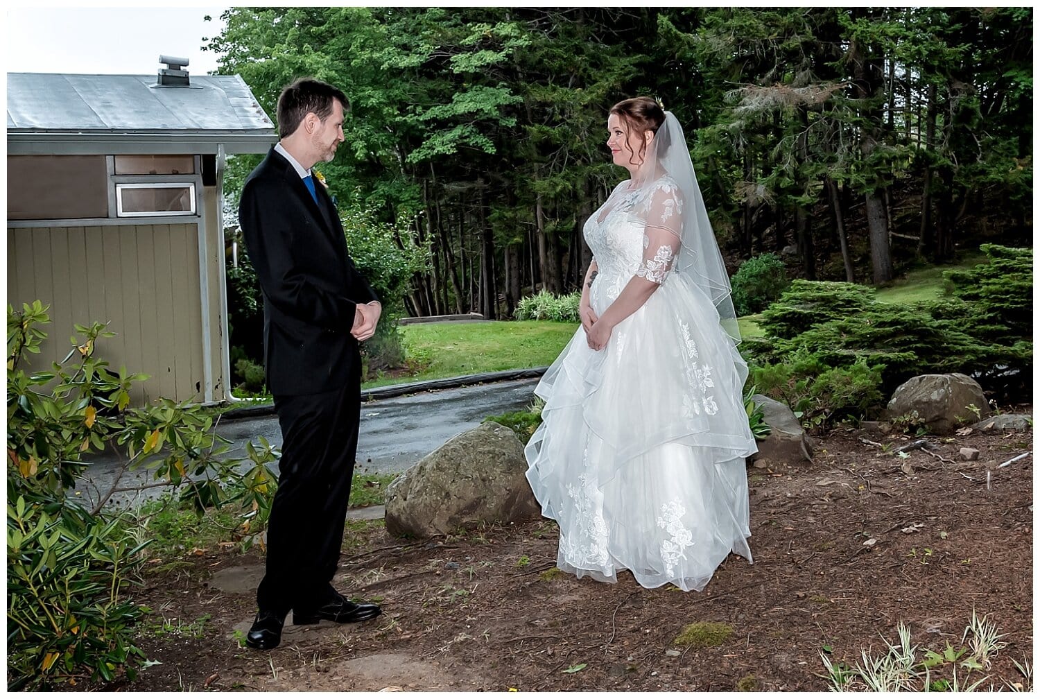 The bride and groom share their first look before their wedding ceremony at Saraguay House in Halifax.