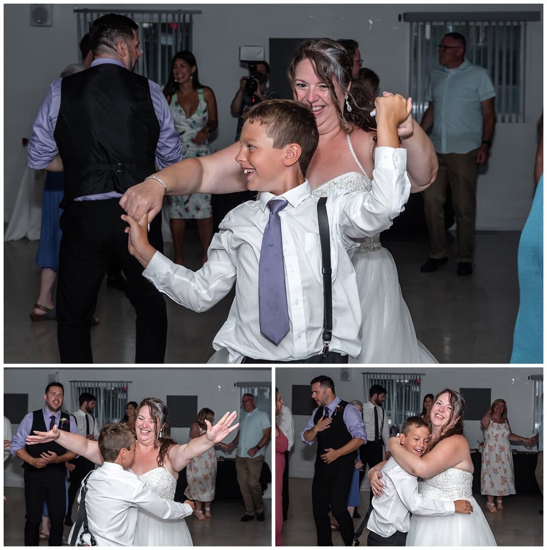 The bride dances with her new son on the dance floor.