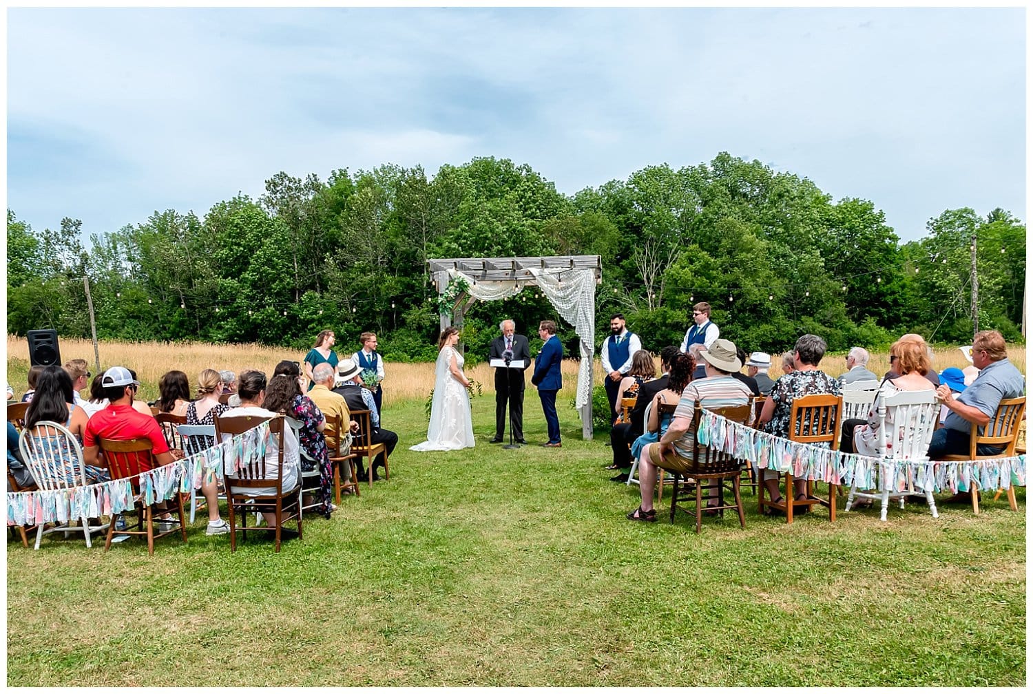 The bride and groom during their rustic wedding ceremony at the Barn at Sadie Belle Farm.