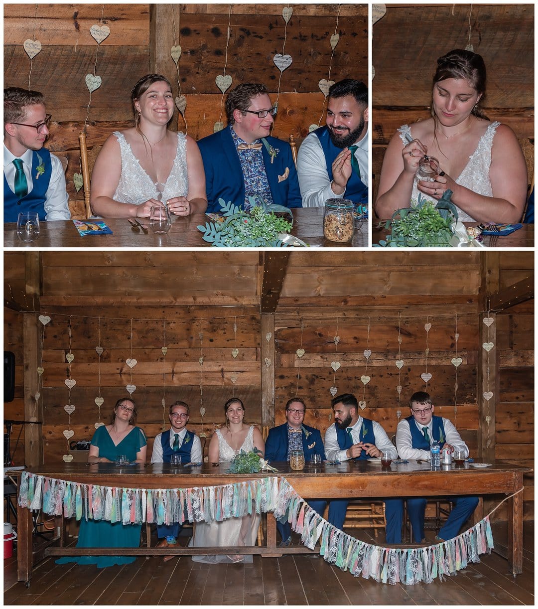 The bride and groom sit at the head table during their wedding reception at the Barn at Sadie Belle Farm.