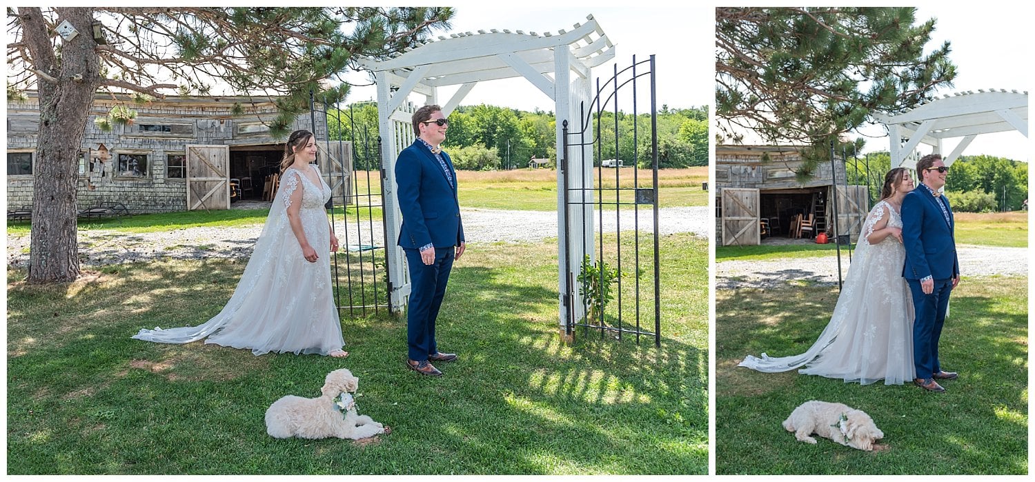 The bride and groom have their first look before their wedding ceremony with their dog watching.