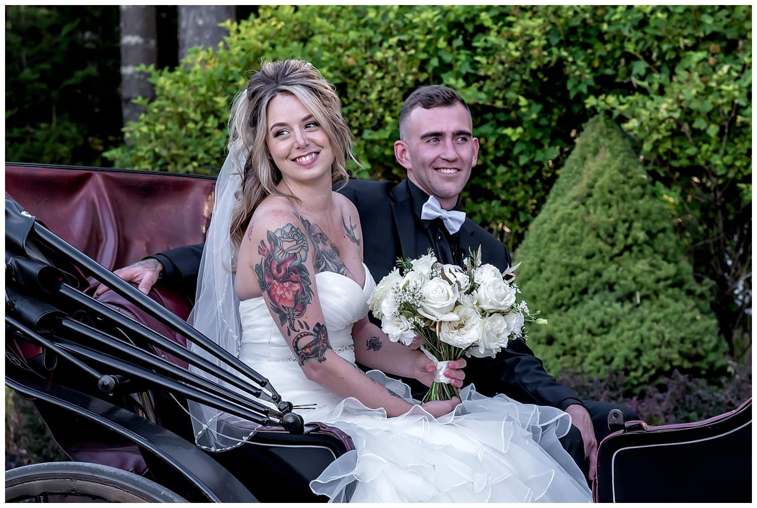 The bride and groom in the horse and carriage after their wedding ceremony at Hatfield Farm.