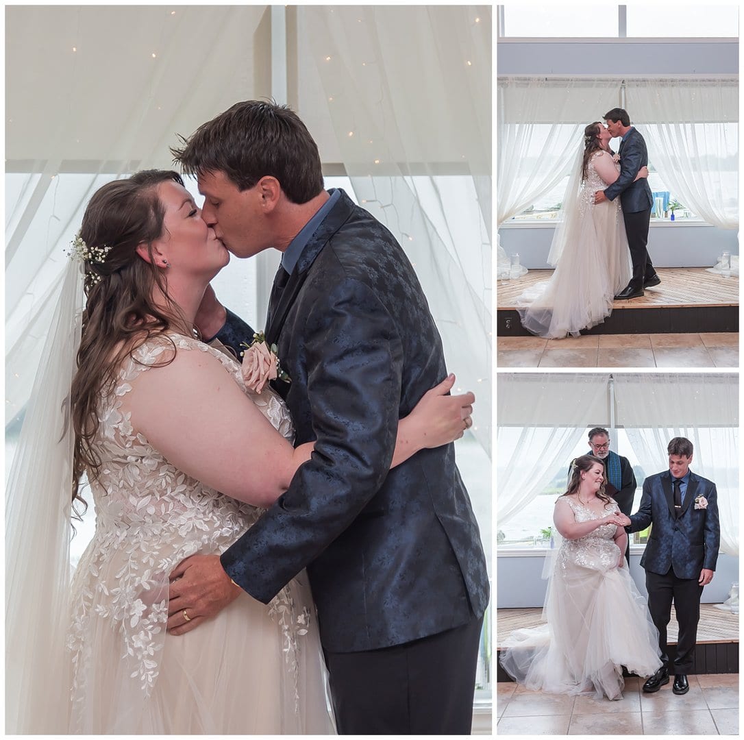 The bride and groom share their first kiss as husband and wife during their wedding ceremony at Fishermans Cove in Eastern Passage NS.