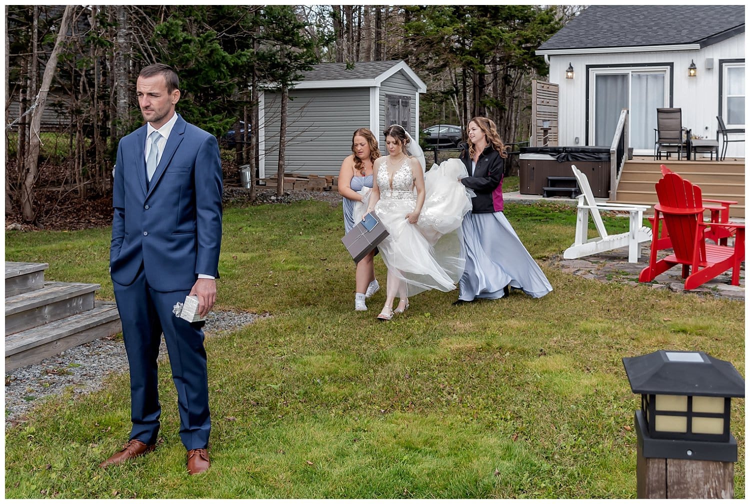 The bride walks towards her groom for a first moment back to back to exchange their personal vows at an Airbnb in Mt Uniacke NS.