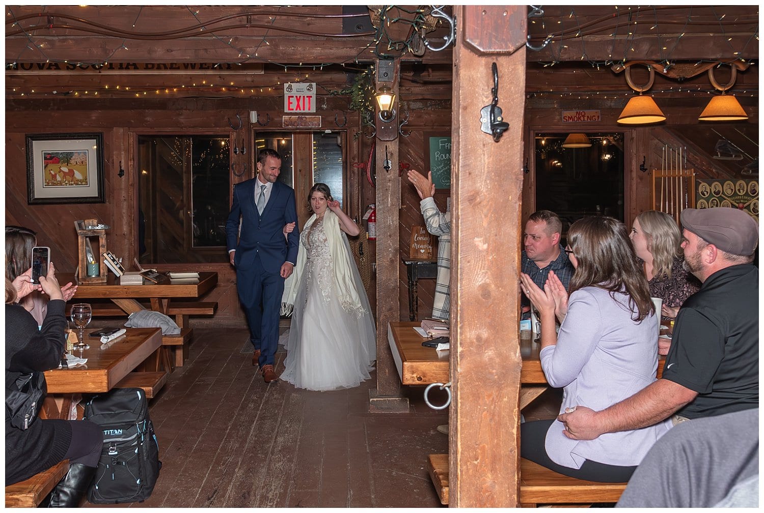 The bride and groom make their entrance into their wedding reception at Hatfield Farm in Nova Scotia.