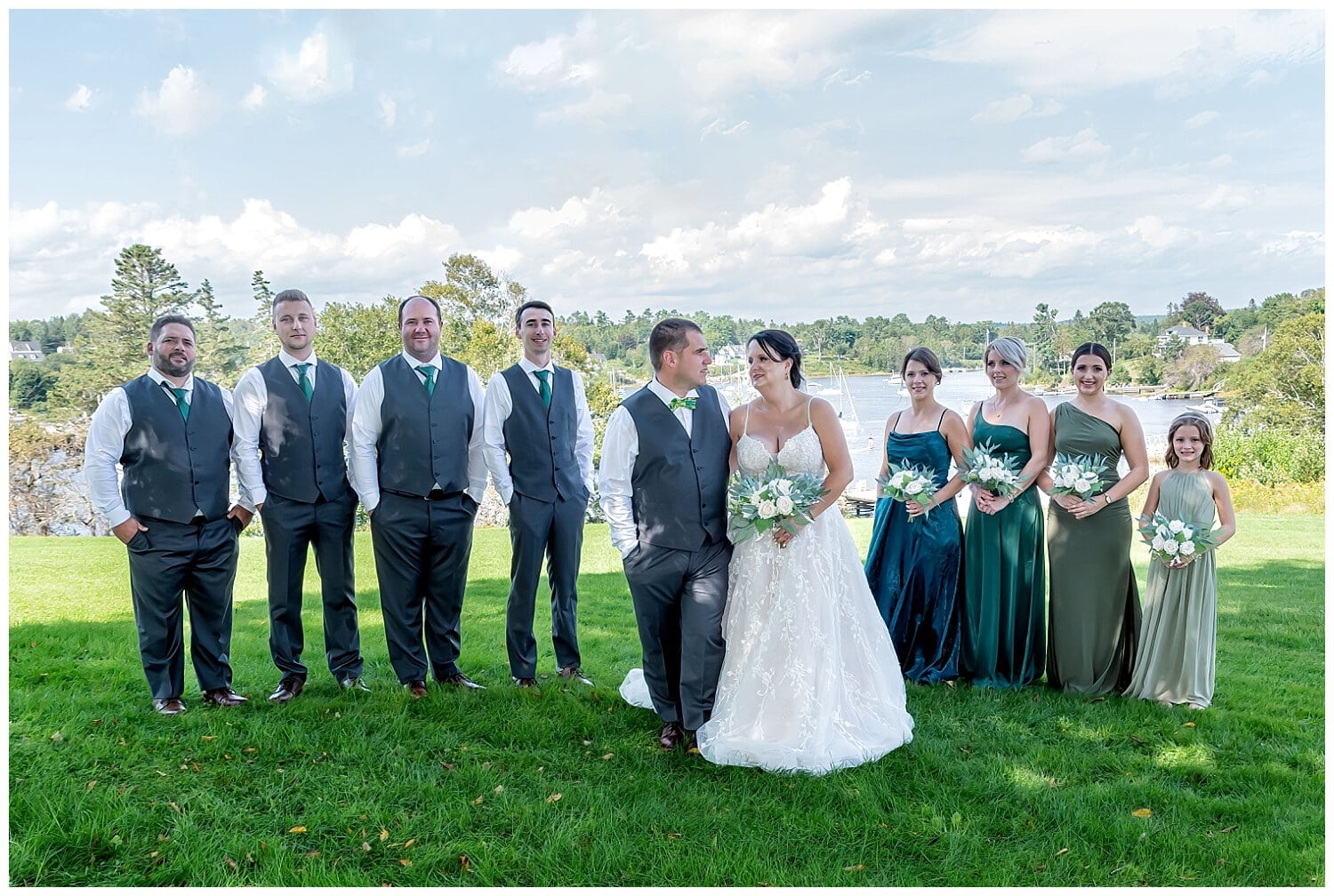 The bride and groom with their wedding party pose for wedding photos in Hubbards NS.