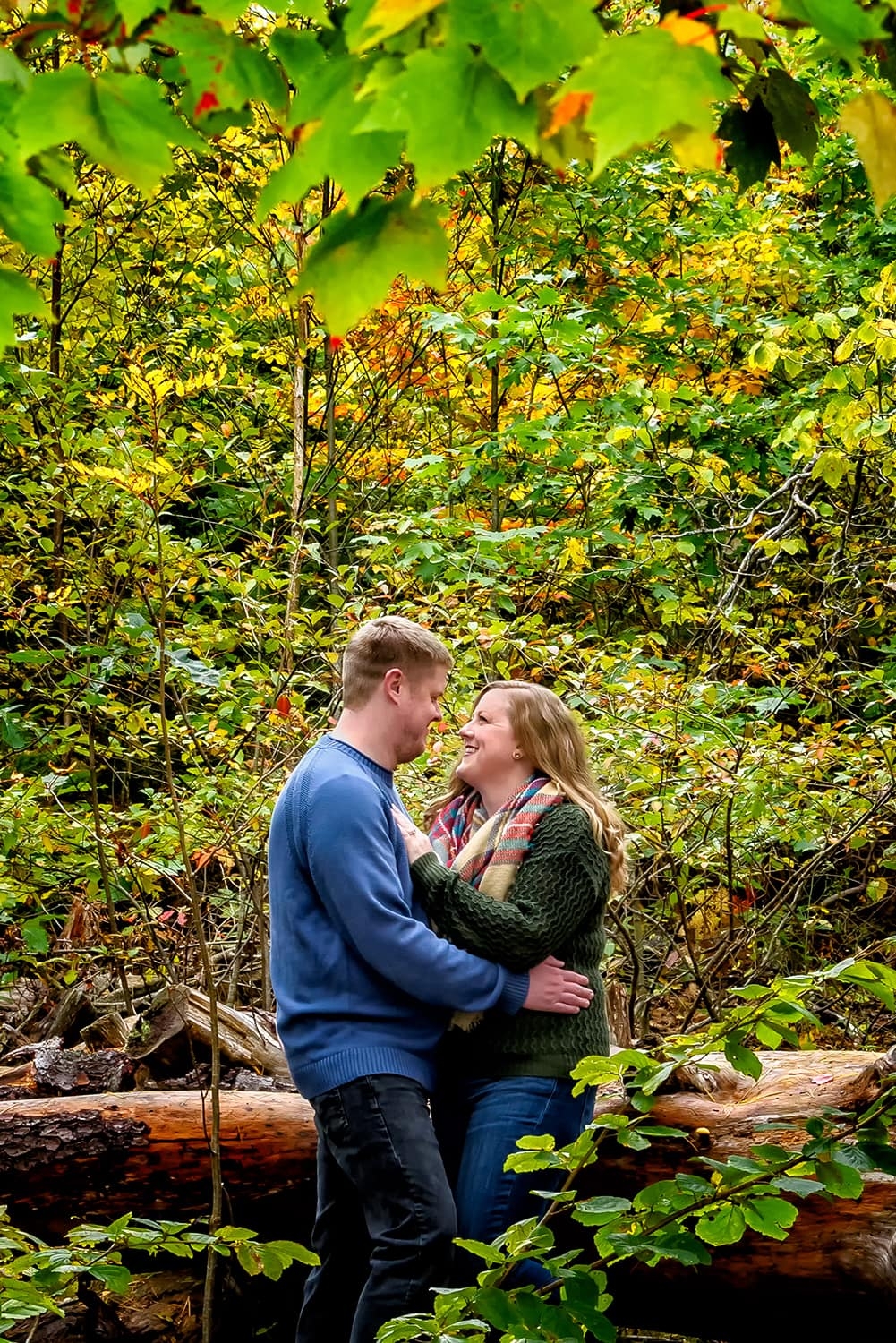 Engagement Portfolio Page A couple in an embrace during their autumn engagement session at Point Pleasant Park in Halifax, NS.