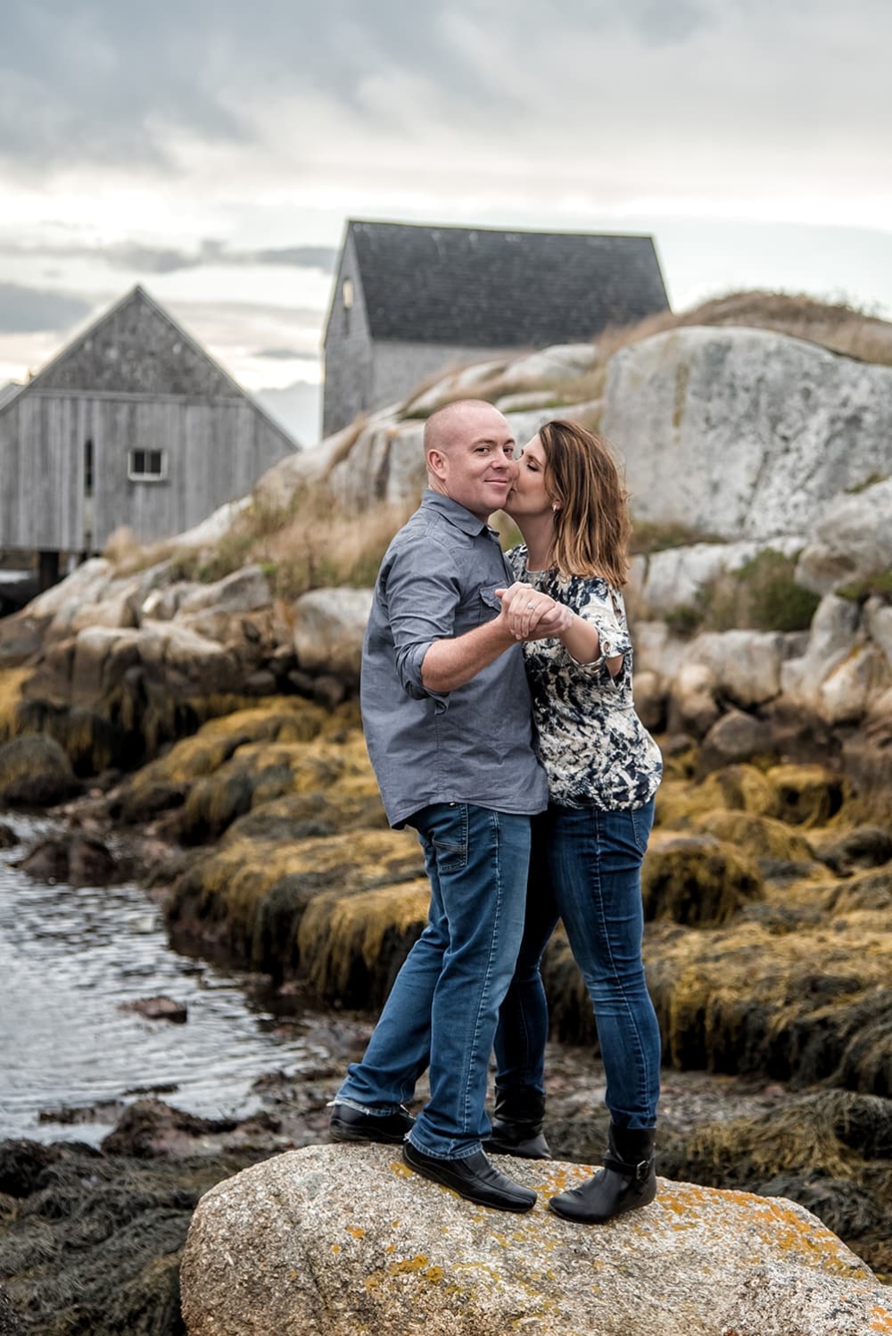 Engagement Portfolio Page A love couple having their engagement photos done at Peggys Cove in Nova Scotia.