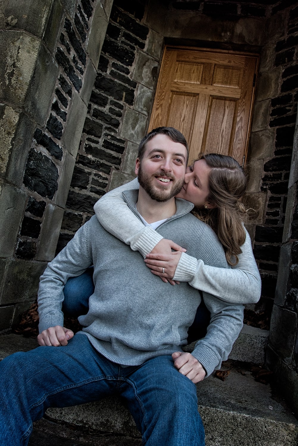 Engagement Portfolio Page A woman hugs her fiance during their engagement photos at Point Pleasant Park in Halifax, NS.