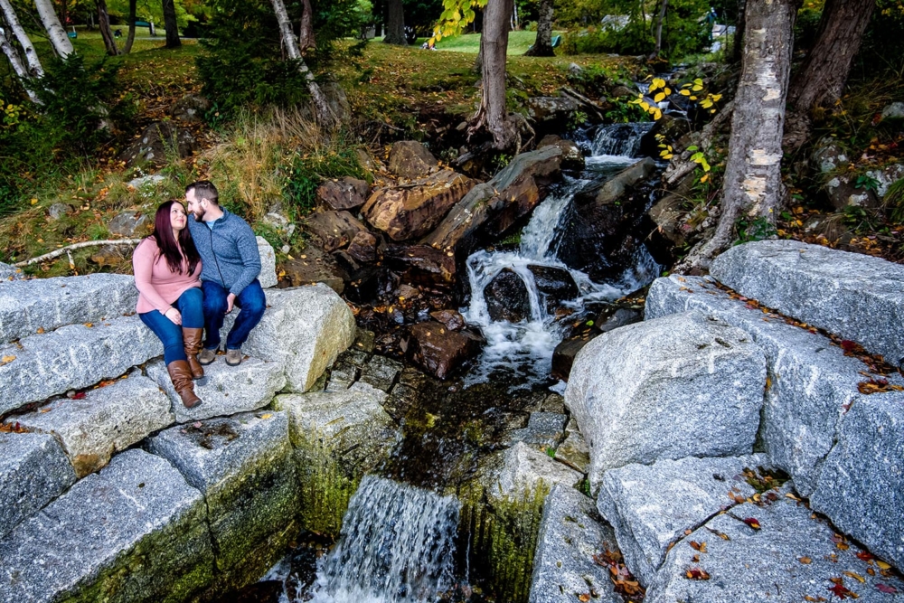 Shauna & Zach <Dingle Tower> A couple in love holding each other by a waterfall during engagement photos at Dingle Park in Halifax, NS
