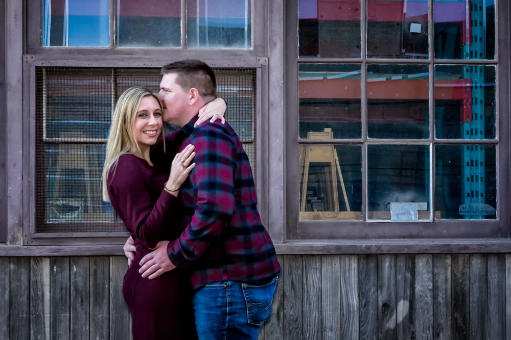 A future bride and groom pose for their engagement photos on the Halifax waterfront.