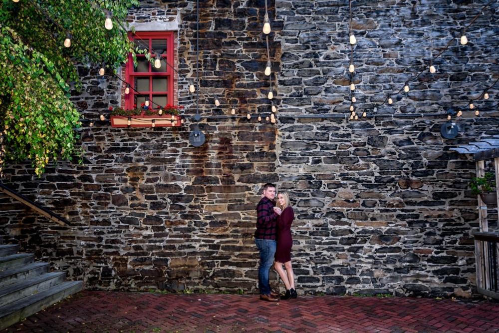 A cute couple embrace during their engagement photos in downtown Halifax, NS.