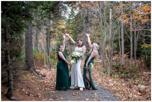 The bride poses for fun wedding photos with her bridesmaids in Sir Fleming Park Halifax NS.