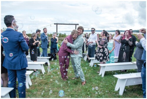 The grooms walk back down the aisle together after their LGBT wedding ceremony at the Hubbards Cam